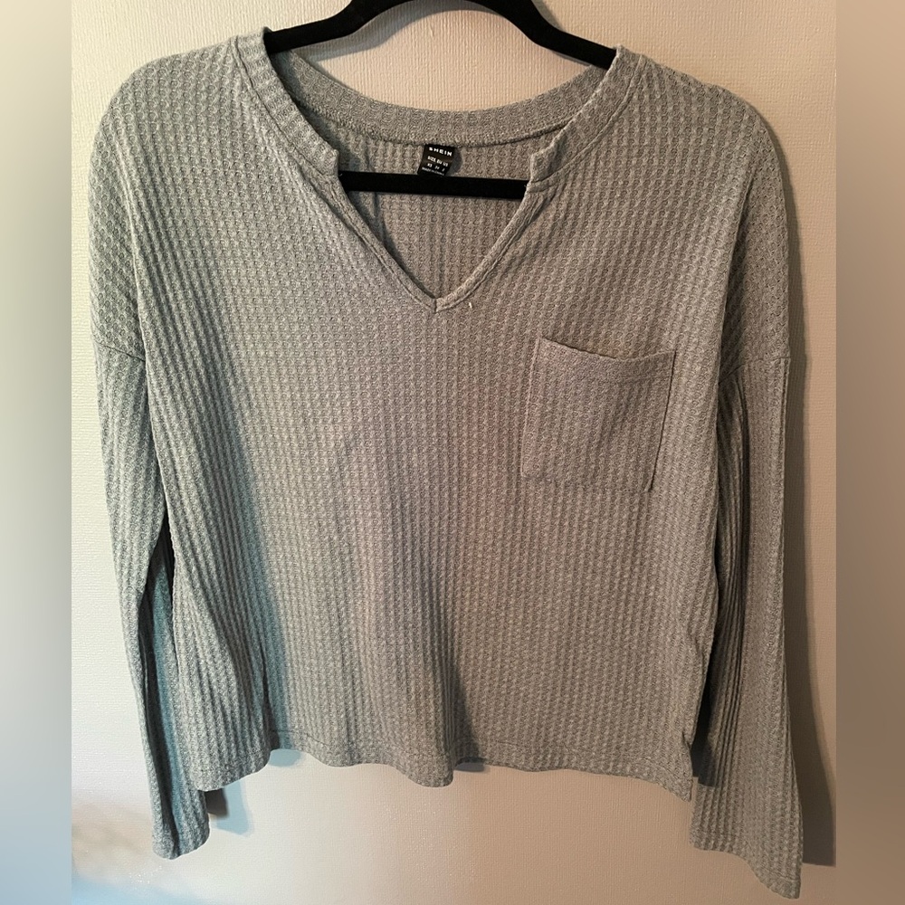 Woman’s SHEIN long sleeve top
